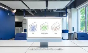 Monitor z trzema schematami budynków ilustrującymi różne rodzaje powierzchni.