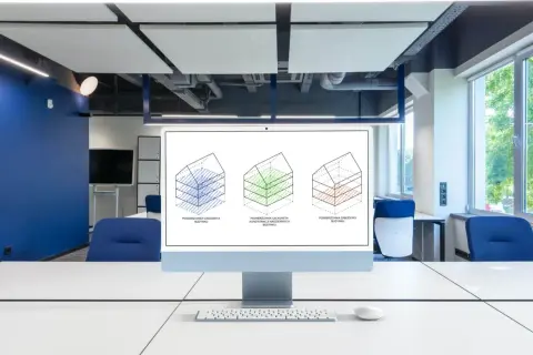 Monitor z trzema schematami budynków ilustrującymi różne rodzaje powierzchni.